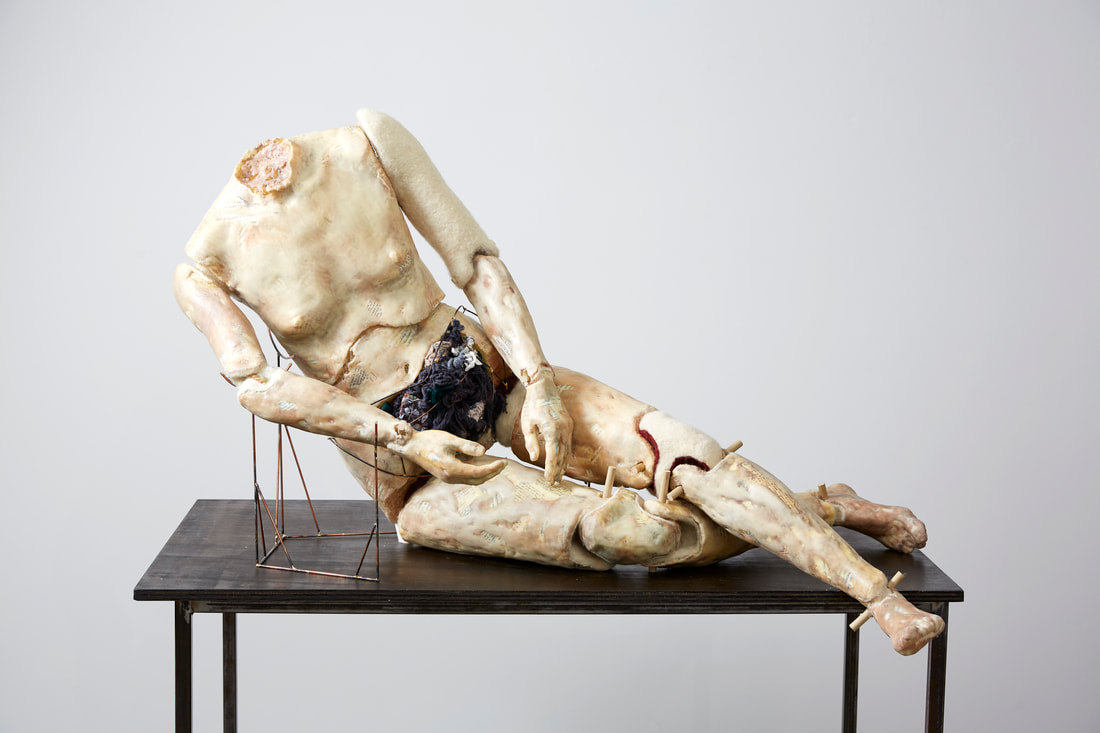 Reclining Nude Female Puppet Segmented Figurative Sculpture covered in letters to lovers and wax.